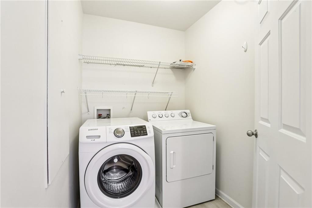 5940 Bentley Way Cumming, GA 30040 - Photo 23 of 39 a utility room with dryer and washer