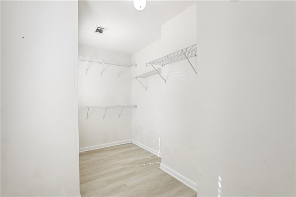 5940 Bentley Way Cumming, GA 30040 - Photo 28 of 39 a view of a room with racks on the wall