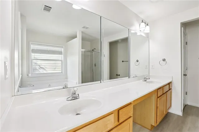 a bathroom with a bathtub and a shower