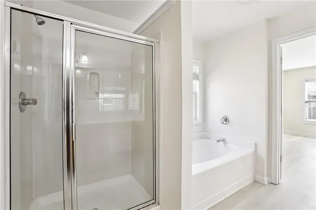 a white bath tub sitting next to a window