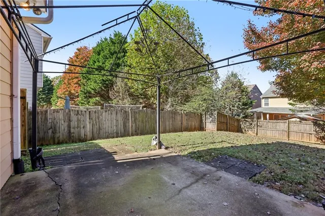 a view of a yard with a tree
