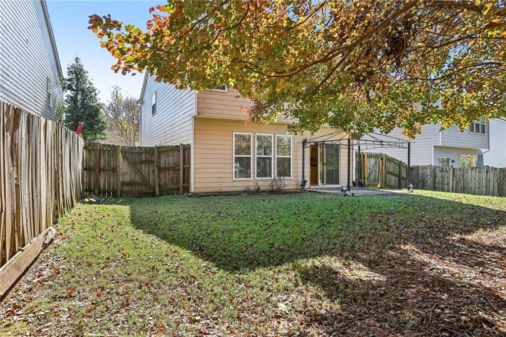 5940 Bentley Way Cumming, GA 30040 - Photo 37 of 39 a view of a house with a yard