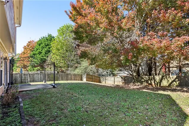 a view of outdoor space with deck and tree