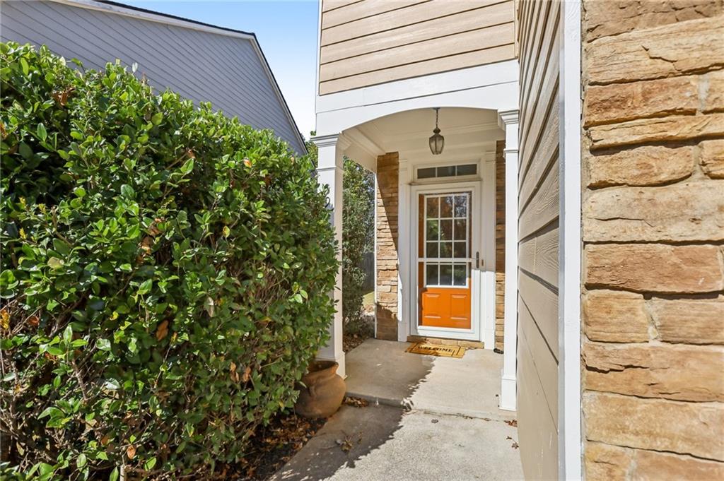 5940 Bentley Way Cumming, GA 30040 - Photo 4 of 39 a view of a house with a small yard