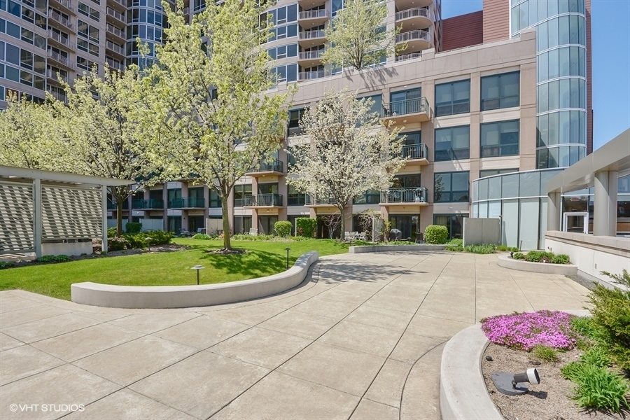 807 Davis Street, Unit 314 Evanston, IL 60201 - Photo 11 of 27 a view of a backyard with a garden and plants