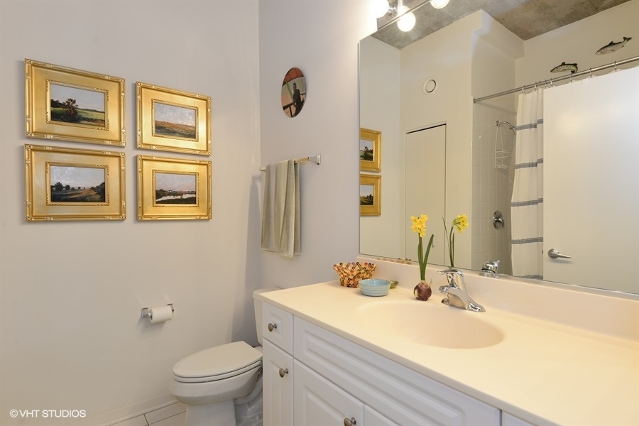 807 Davis Street, Unit 314 Evanston, IL 60201 - Photo 10 of 27 a bathroom with a sink toilet and shower