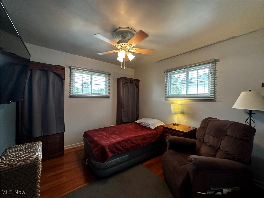 739 Sterling Road Wickliffe, OH 44092 - Photo 16 of 27 Bedroom featuring multiple windows, hardwood / wood-style flooring, and ceiling fan