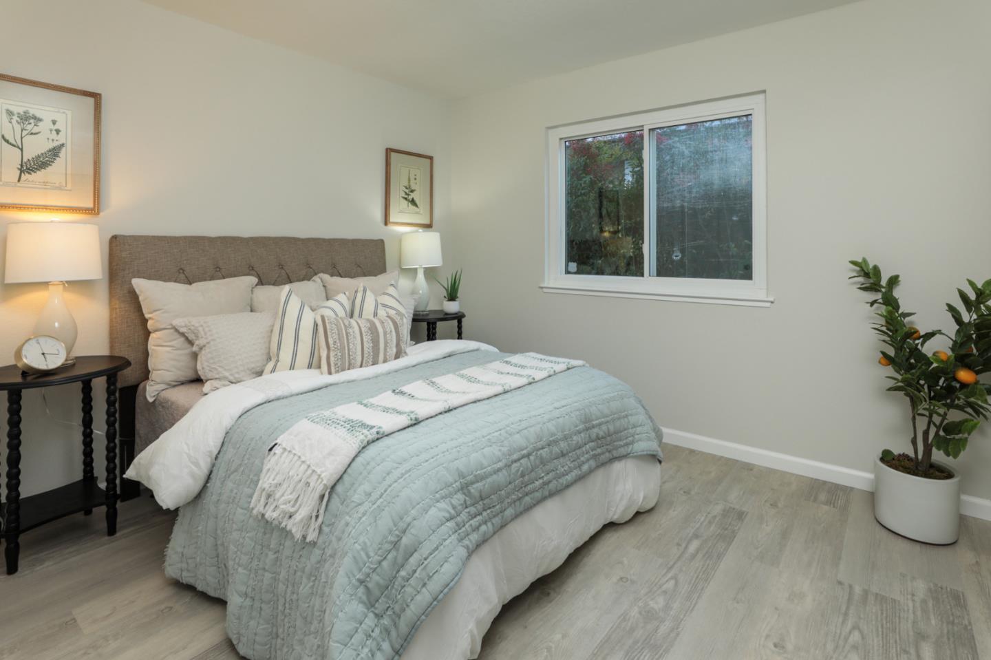4057 Ashbrook Circle San Jose, CA 95124 - Photo 12 of 15 a bedroom with bed and window