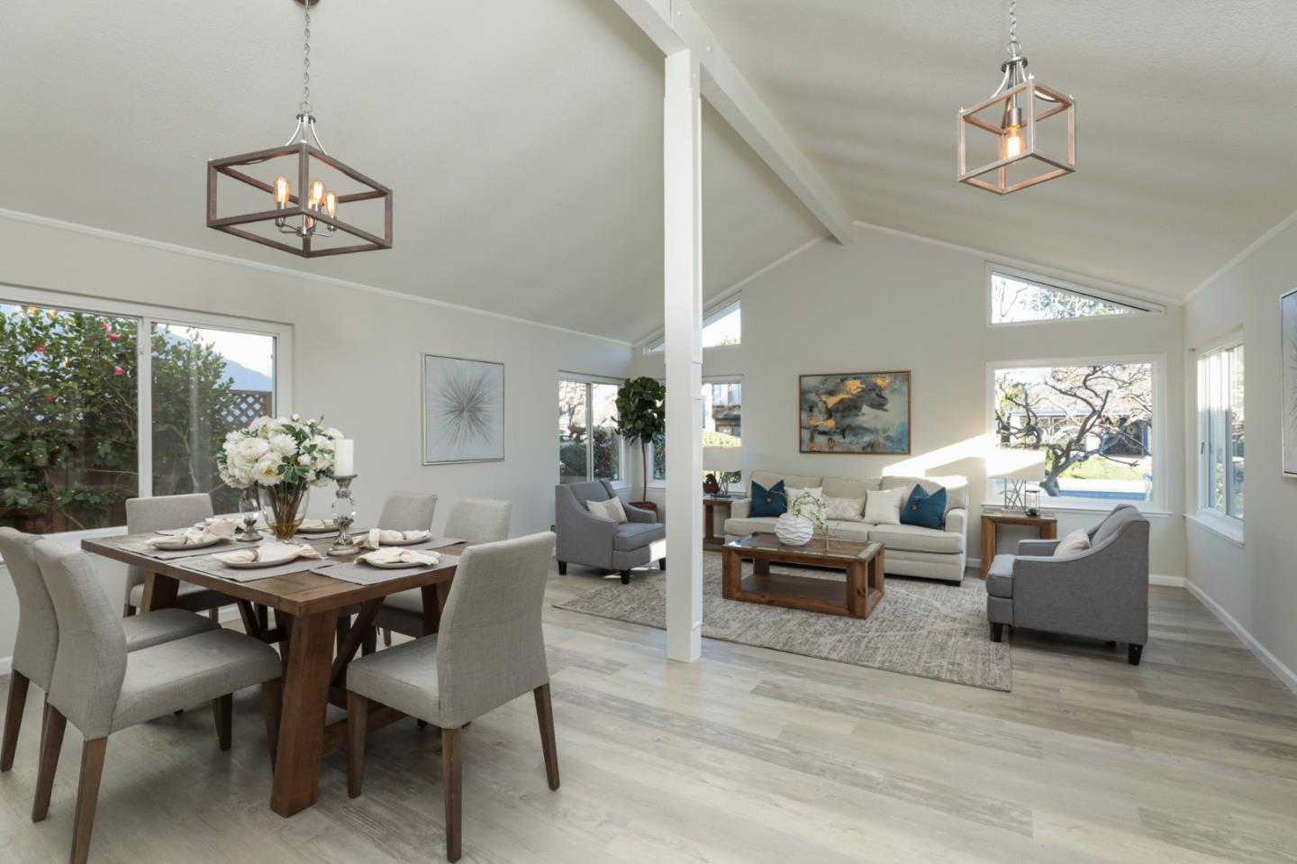 4057 Ashbrook Circle San Jose, CA 95124 - Photo 3 of 15 a view of a dining room with furniture wooden floor and chandelier