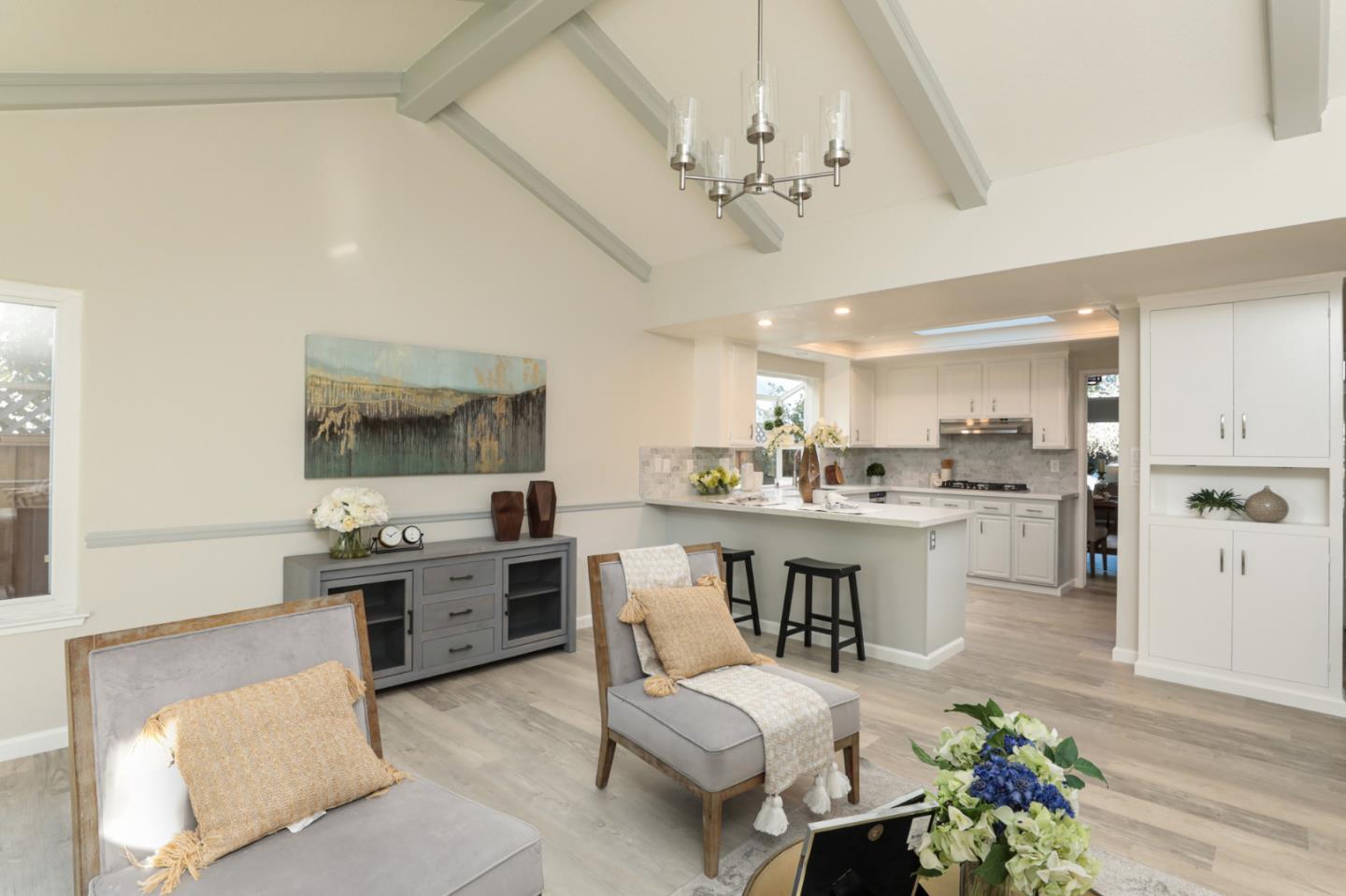 4057 Ashbrook Circle San Jose, CA 95124 - Photo 6 of 15 a large white kitchen with a table and chairs in it
