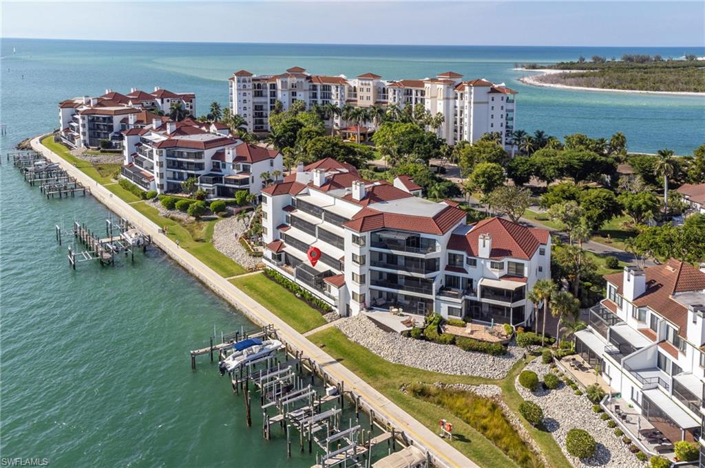 305 La Peninsula Boulevard, Unit 305 Naples, FL 34113 - Photo 22 of 23 a view of a city with tall buildings
