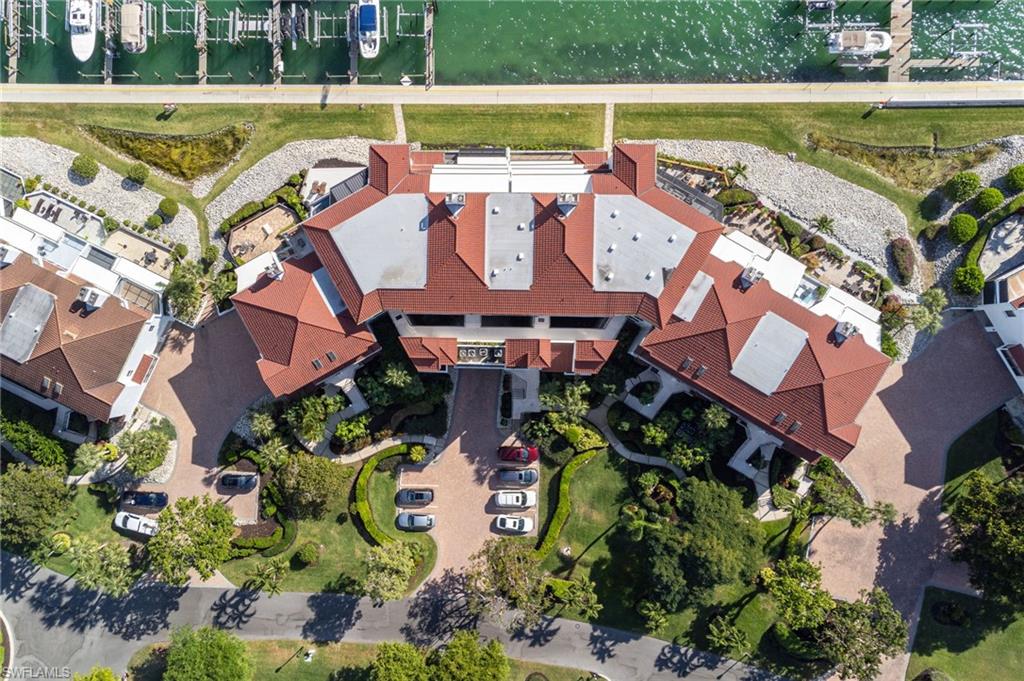 305 La Peninsula Boulevard, Unit 305 Naples, FL 34113 - Photo 23 of 23 an aerial view of a house with a outdoor space