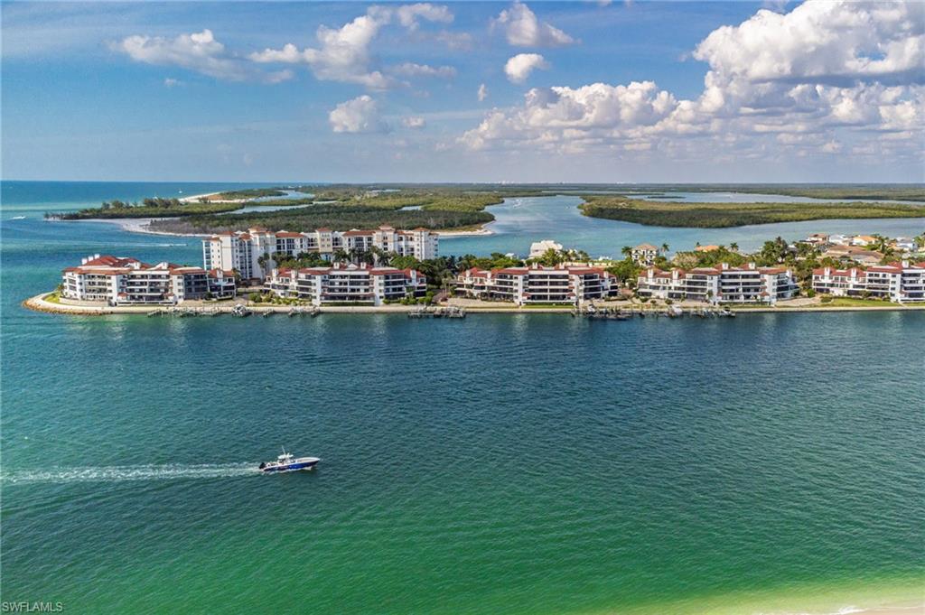 305 La Peninsula Boulevard, Unit 305 Naples, FL 34113 - Photo 5 of 23 a view of a city with tall buildings