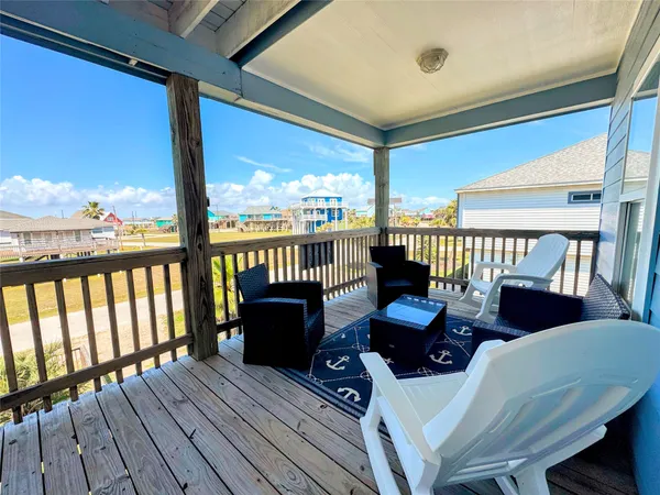 a view of a patio with wooden floor