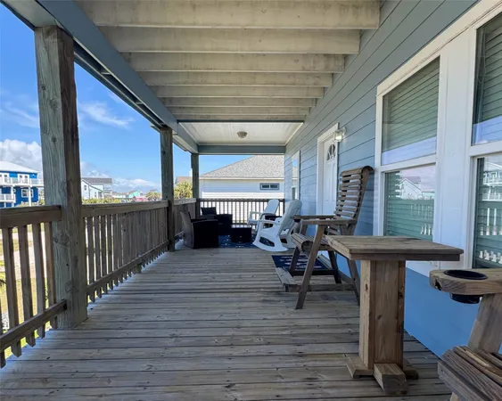 a view of a house with a porch and furniture