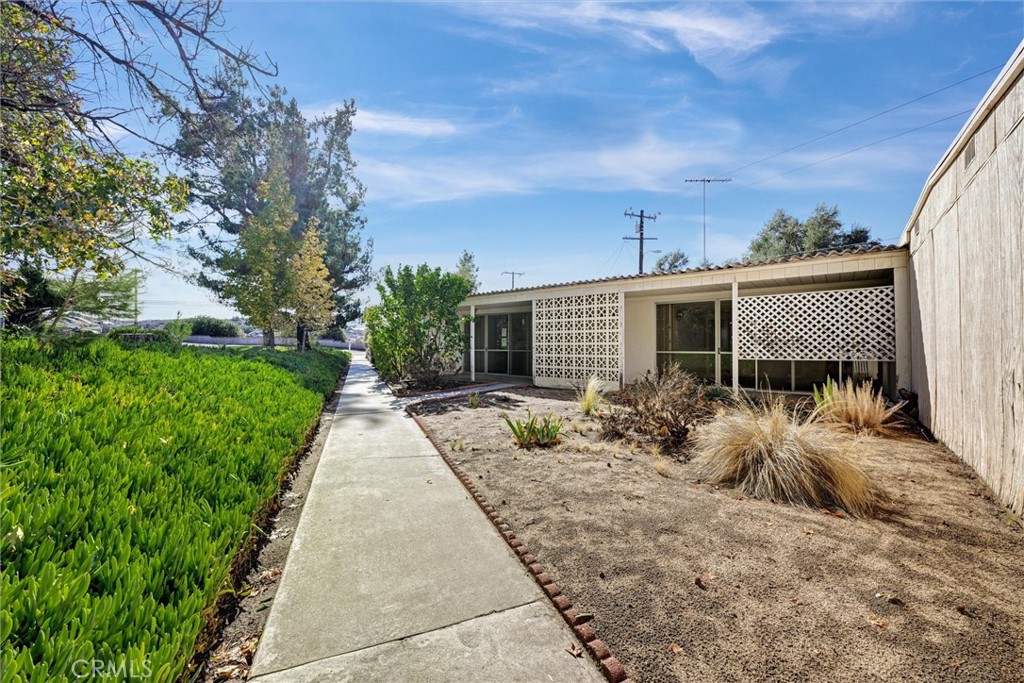 604 Gibbel Road Hemet, CA 92543 - Photo 2 of 29 front view of a house with a yard and potted plants