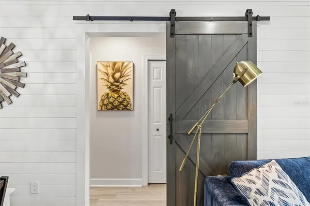 a bedroom with a bed and a view of bathroom