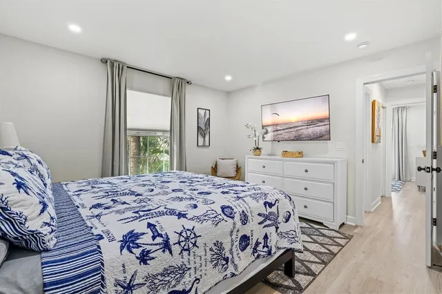 a view of yard with deck and wooden fence