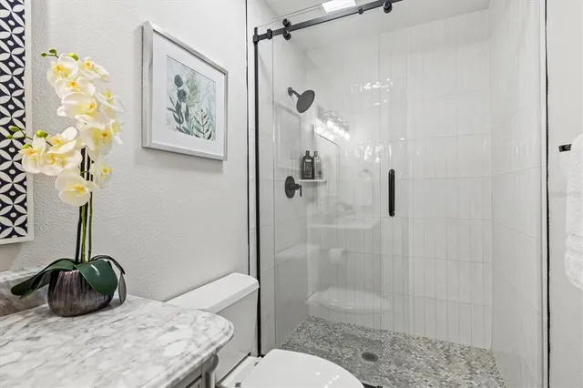 a living room with furniture wooden floor and a large window