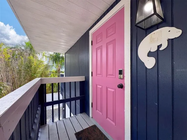 a bedroom with a large bed and a large window