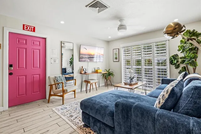 a bathroom with a sink mirror toilet and shower