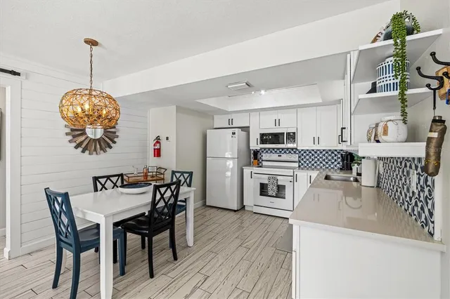 a view of a chair and table in the balcony