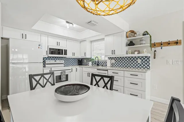 a backyard of a house with outdoor seating