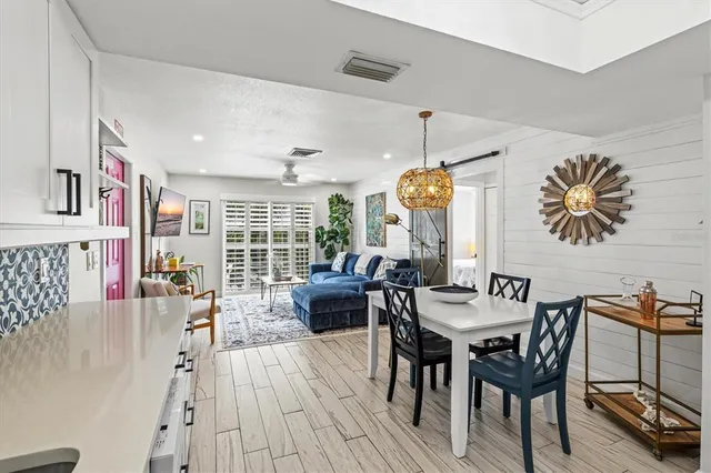 a view of patio with a table and chairs under an umbrella