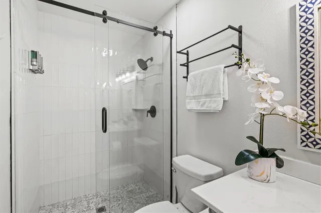 a front view of multi story commercial building with retail shops