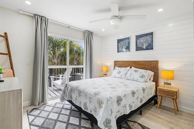 a view of a patio with table and chairs potted plants with wooden floor