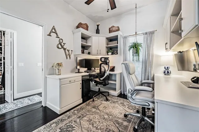a view of a workspace with furniture and living room