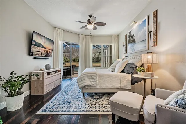 a living room with furniture a dining table and paintings on the wall