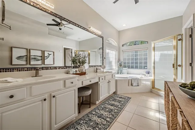 a large white kitchen with a large window