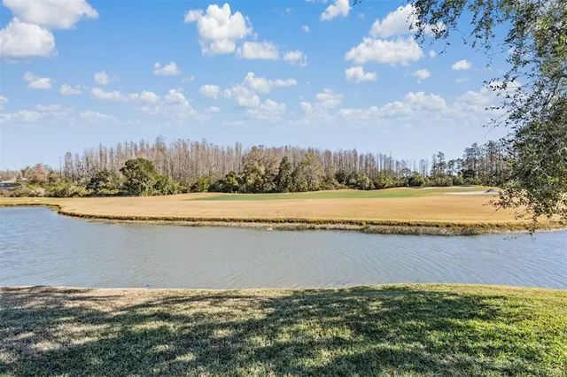 a view of a lake with a big yard
