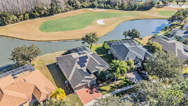 an aerial view of a house with outdoor space