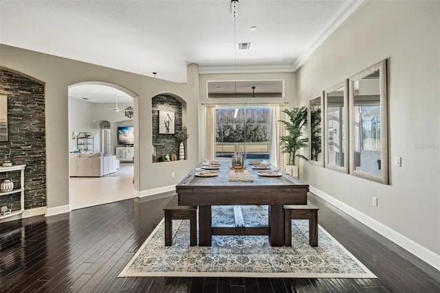 a view of a workspace with furniture and window