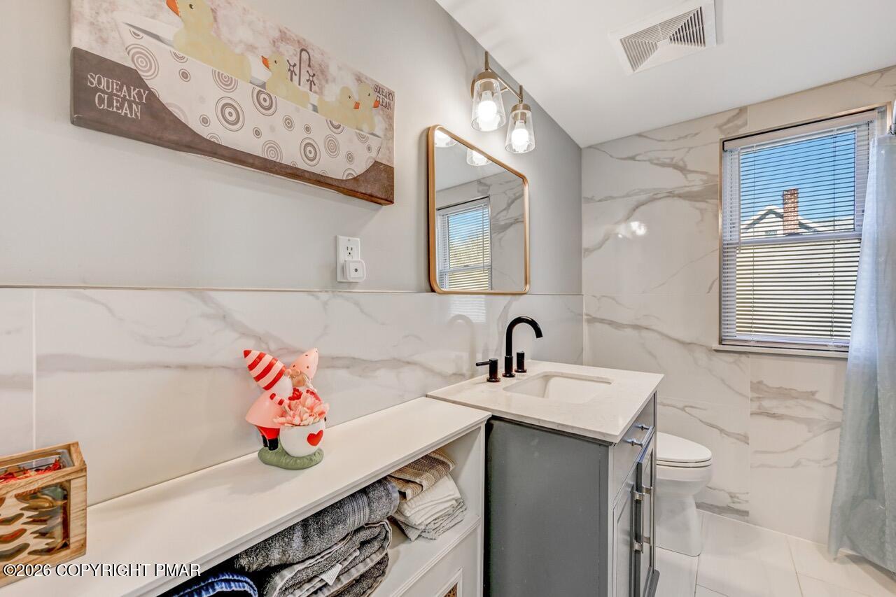 112 Trach Road Kunkletown, PA 18058 - Photo 29 of 48 a bathroom with a sink mirror and vanity