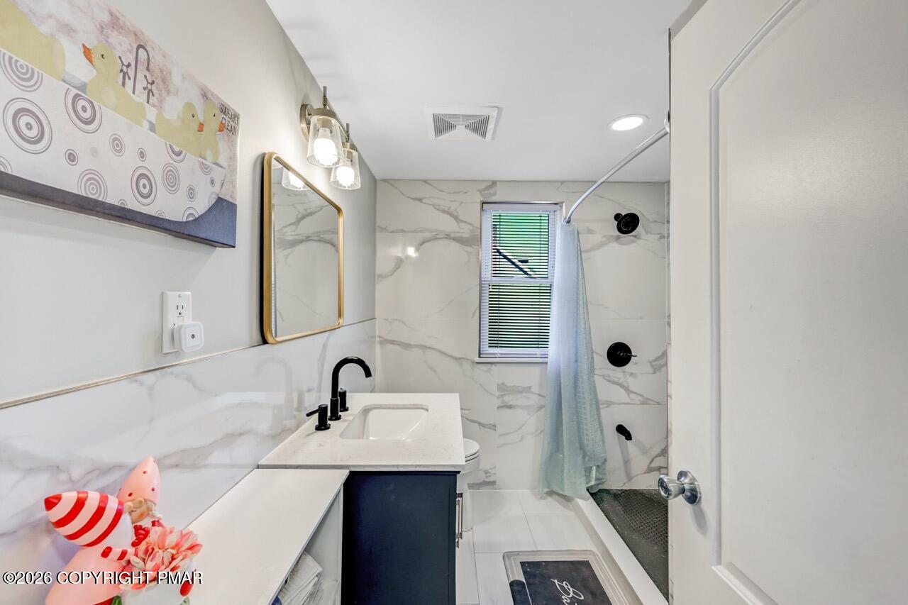 112 Trach Road Kunkletown, PA 18058 - Photo 30 of 48 a bathroom with a sink and a mirror