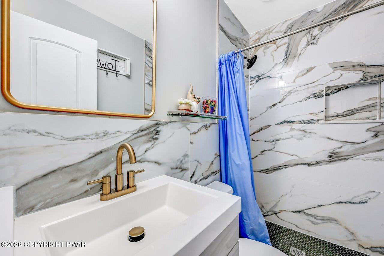112 Trach Road Kunkletown, PA 18058 - Photo 10 of 48 a bathroom with a sink and a mirror