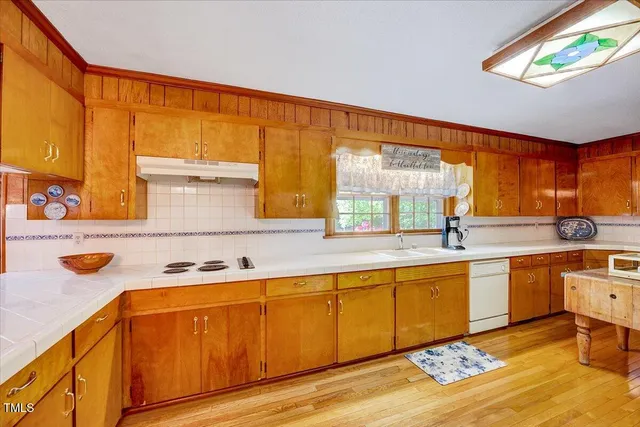 a balcony with table and chairs