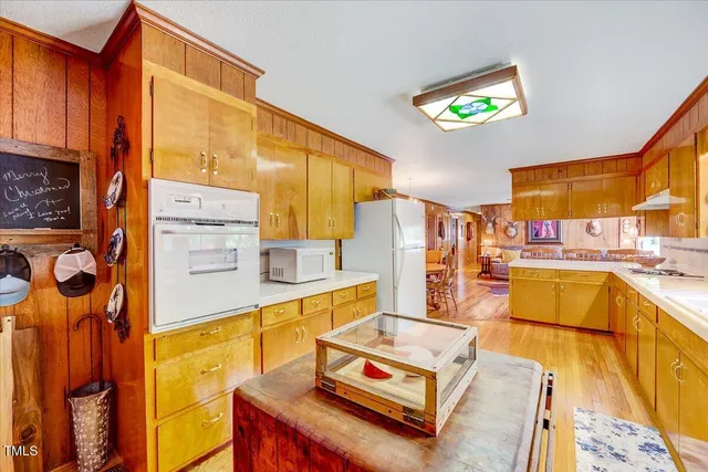 a kitchen with granite countertop cabinets and windows