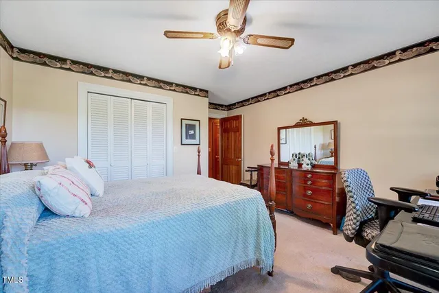 a bed room with a bed and a chandelier