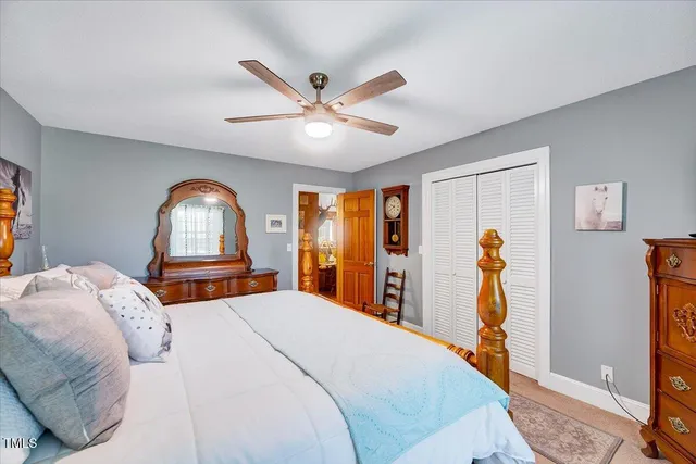 a bed room with a bed and a chandelier