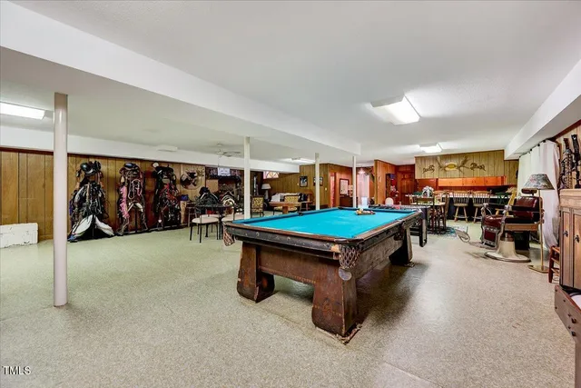 a view of a livingroom with furniture and a fireplace