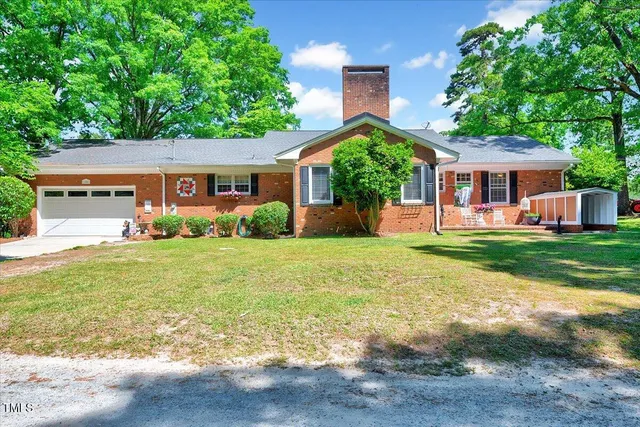 a view of a big yard with swimming pool
