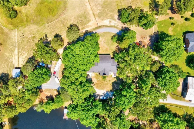 a view of a lake with a small yard