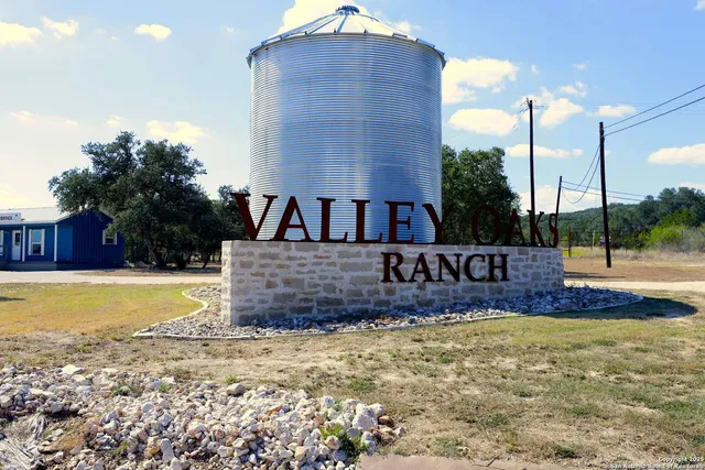 a sign board on the side of a yard