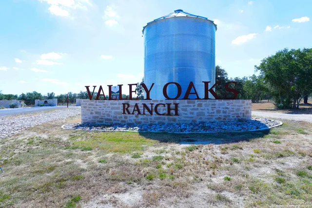 a view of a wooden house with a yard