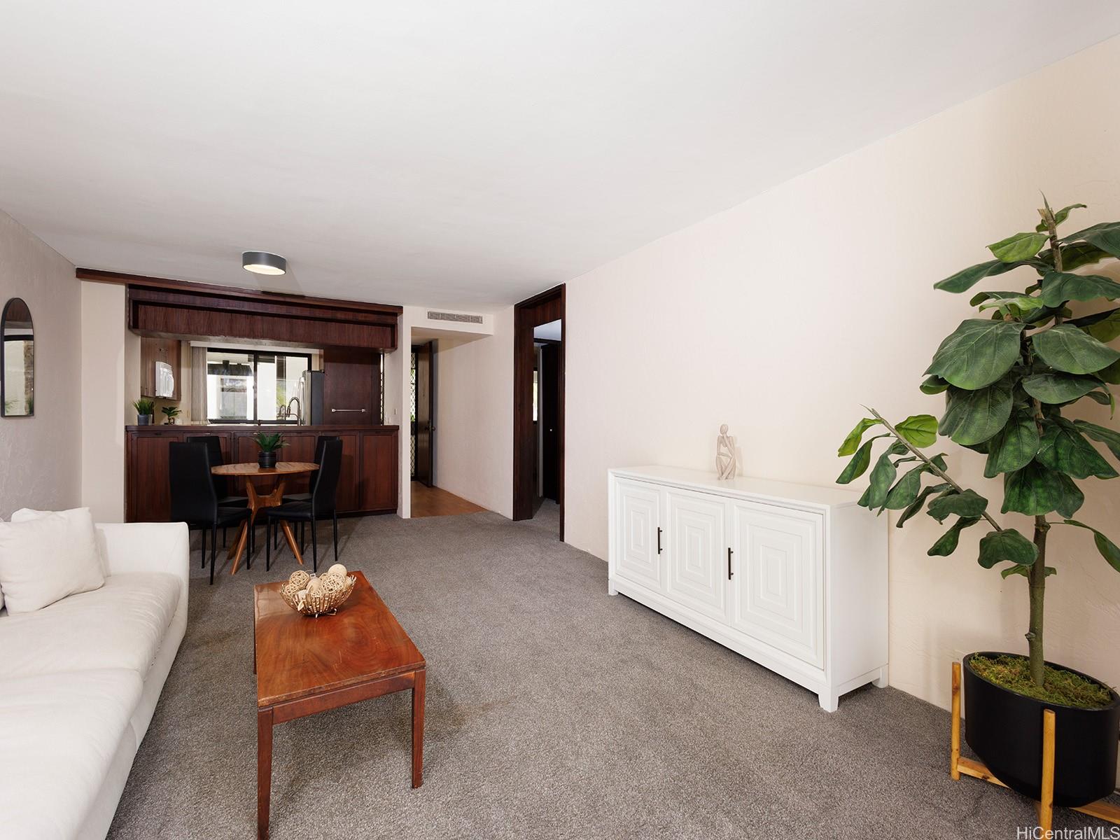 500 Lunalilo Home Road, Unit 13B Honolulu, HI 96825 - Photo 5 of 17 a living room with furniture a potted plant and a table