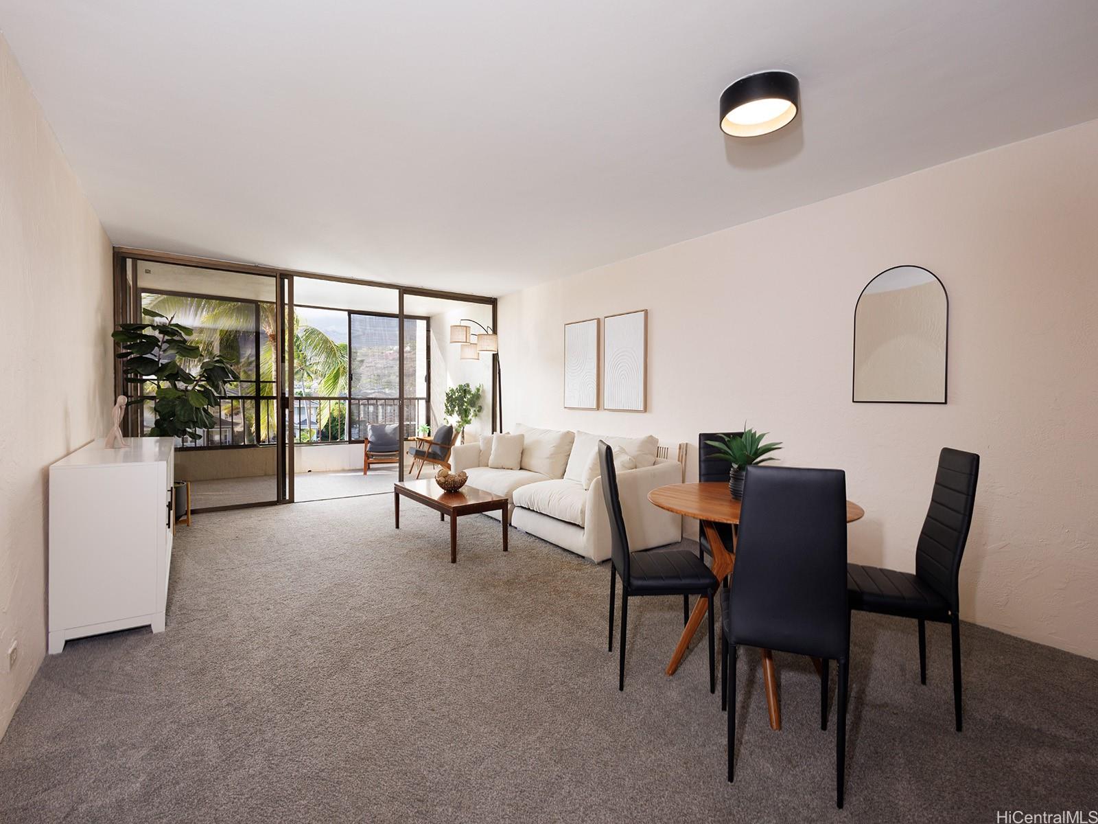 500 Lunalilo Home Road, Unit 13B Honolulu, HI 96825 - Photo 6 of 17 a living room with furniture and a potted plant
